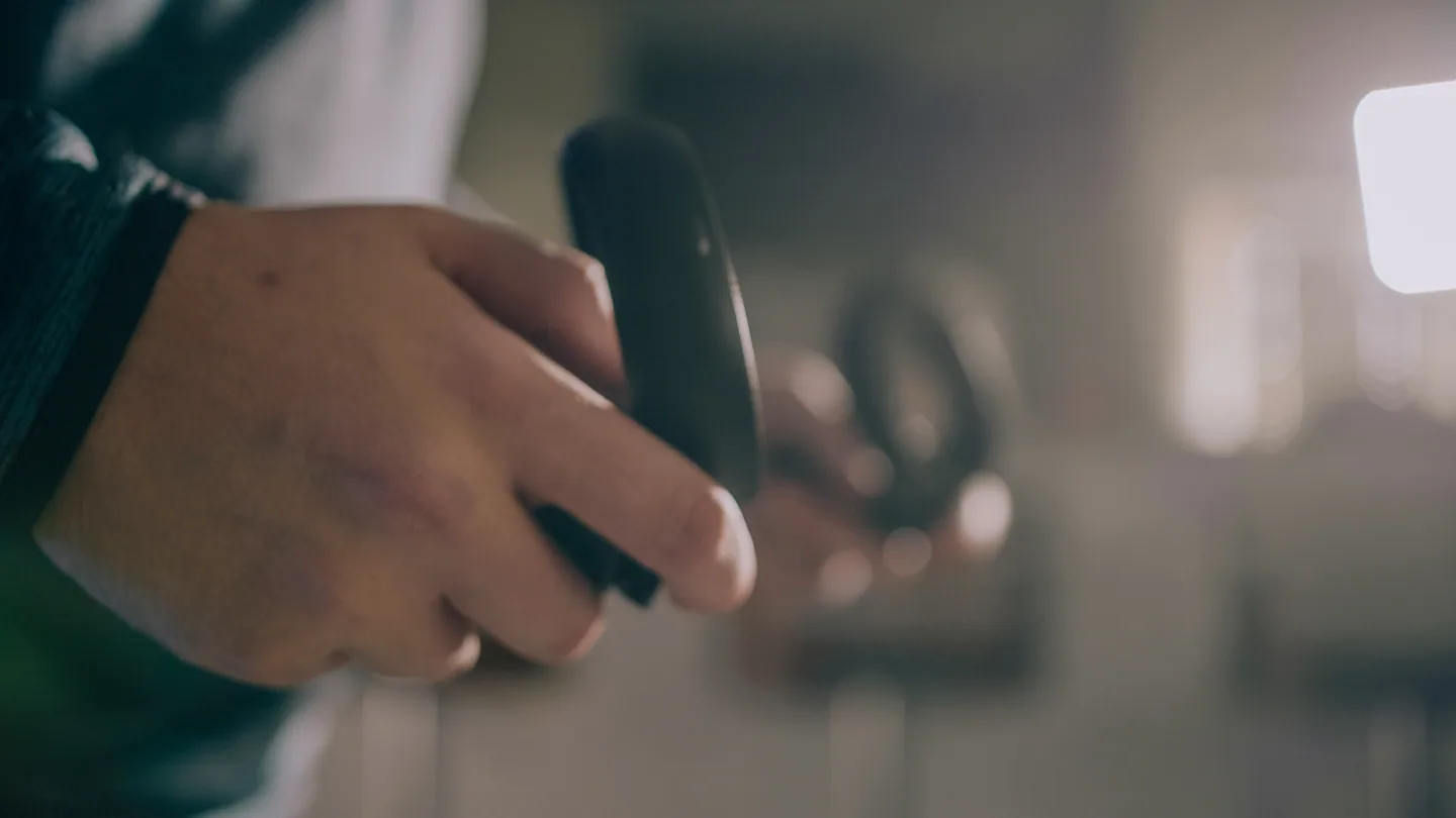 Person holding VR controllers